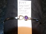 Amethyst set silver bangle gold clasp. Click for more information...