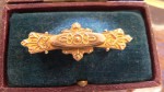 cased late 1800s mourning brooch 9 ct gold. Click for more information...