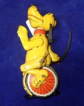 an1021 1950s Linemar tin toy Pluto unicycle wind up. Click for more information...