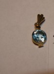 9ct Gold pendant with blue stone. Click for more information...