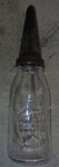 ant128 Nice old Caltex embossed oil bottle with tin top. Click for more information...