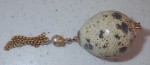 an124 Small decorated egg shell looks like a pendant. Click for more information...