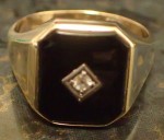 Mens 9ct gold adorn Onyx and Diamond ring. Click for more information...